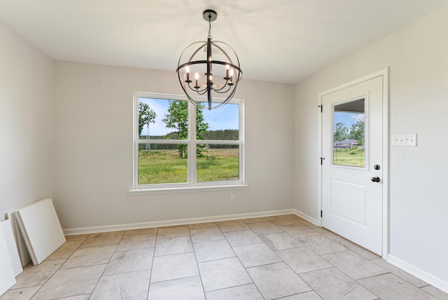15987 E Miller Sardis Rd, Bauxite, AR 72011 - unfurnished dining area with a chandelier and baseboards