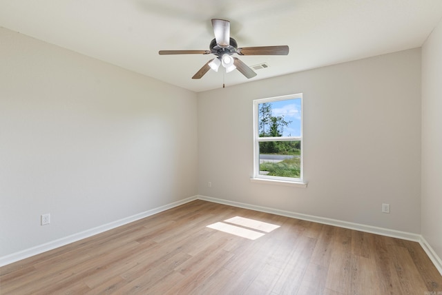 15987 E Miller Sardis Rd, Bauxite, AR 72011 - spare room featuring light wood finished floors, baseboards, and a ceiling fan
