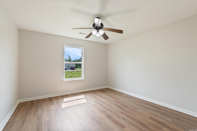 15987 E Miller Sardis Rd, Bauxite, AR 72011 - spare room featuring light wood-style floors, baseboards, and ceiling fan