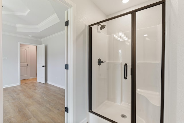 15987 E Miller Sardis Rd, Bauxite, AR 72011 - bathroom featuring wood finished floors, a shower stall, baseboards, and crown molding