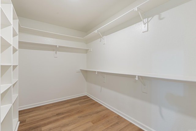 15987 E Miller Sardis Rd, Bauxite, AR 72011 - walk in closet featuring wood finished floors
