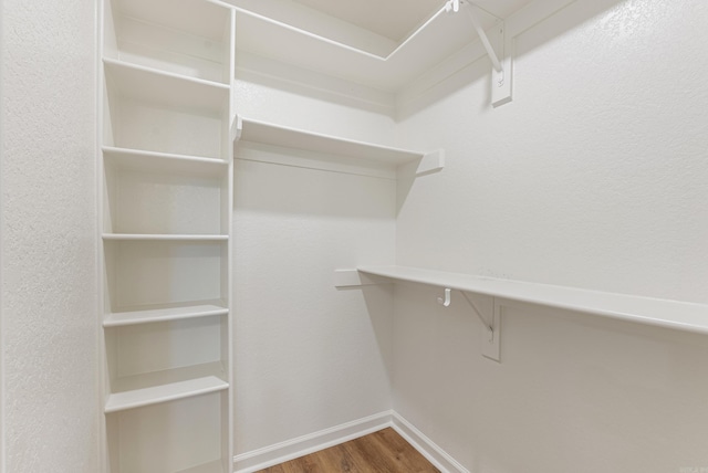 15987 E Miller Sardis Rd, Bauxite, AR 72011 - spacious closet featuring wood finished floors