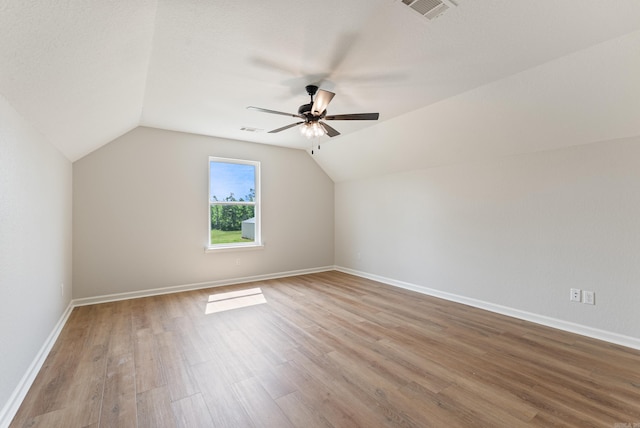 15987 E Miller Sardis Rd, Bauxite, AR 72011 - additional living space featuring lofted ceiling, wood finished floors, a ceiling fan, and baseboards