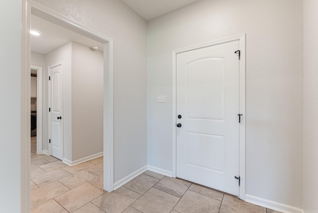 15987 E Miller Sardis Rd, Bauxite, AR 72011 - entryway with light tile patterned floors and baseboards