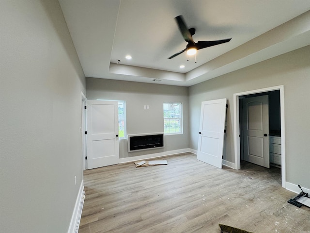 207 W Military Rd, North Little Rock, AR 72118 - unfurnished bedroom featuring baseboards, wood finished floors, a raised ceiling, recessed lighting, and ceiling fan