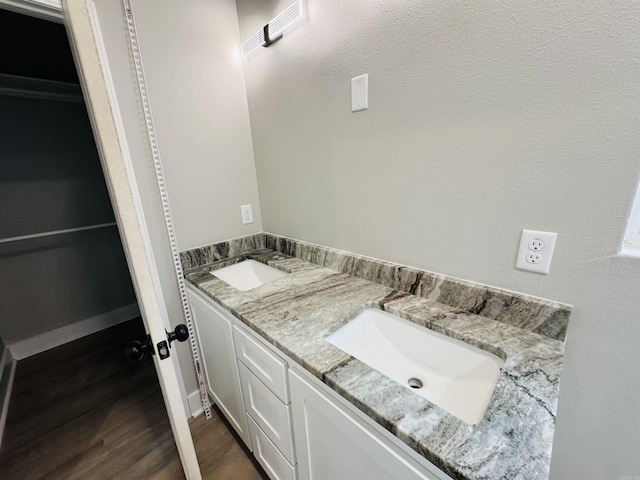 207 W Military Rd, North Little Rock, AR 72118 - bathroom featuring double vanity and wood finished floors