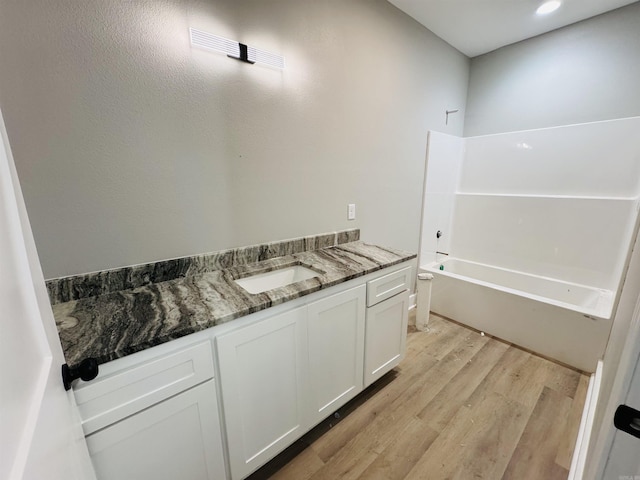 207 W Military Rd, North Little Rock, AR 72118 - full bath featuring vanity, wood finished floors, and toilet