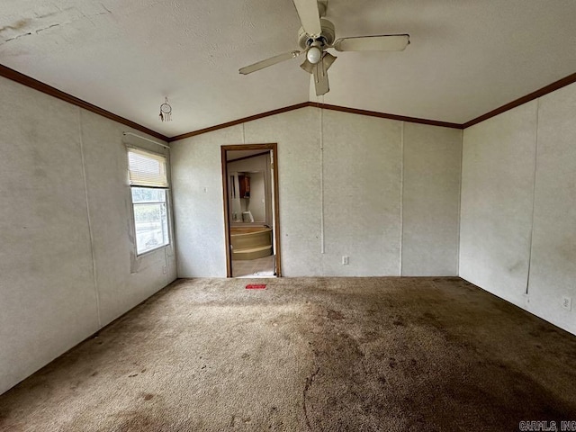 4530 Hwy 8 E, Mena, AR 71953 - carpeted spare room featuring vaulted ceiling, ornamental molding, and ceiling fan