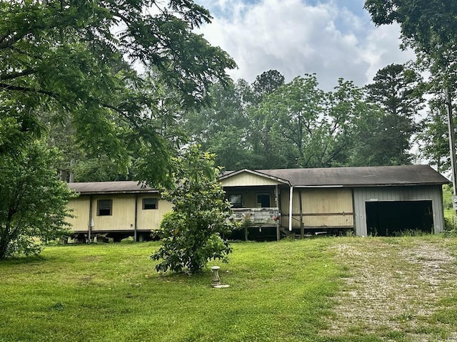 4530 Hwy 8 E, Mena, AR 71953 - view of front of home featuring a front lawn and a garage