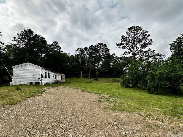 4530 Hwy 8 E, Mena, AR 71953 - view of green lawn with dirt driveway