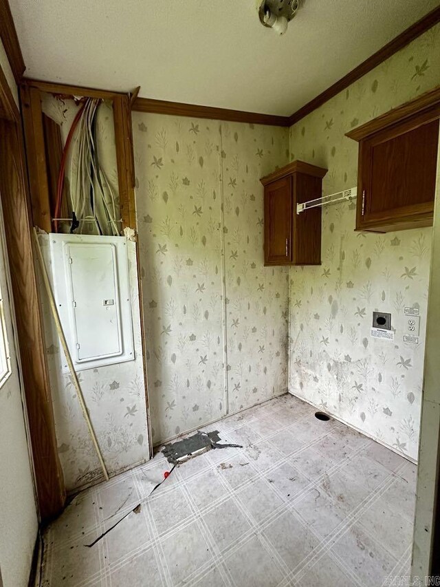 4530 Hwy 8 E, Mena, AR 71953 - laundry room featuring electric panel, light flooring, and crown molding