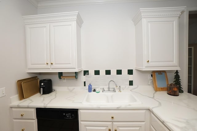 kitchen with dishwasher, a sink, and white cabinetry