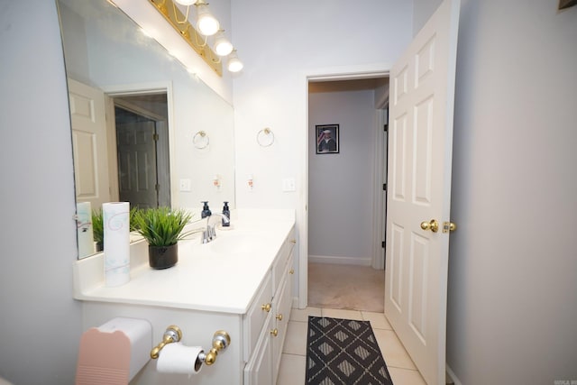 bathroom with tile patterned flooring and vanity