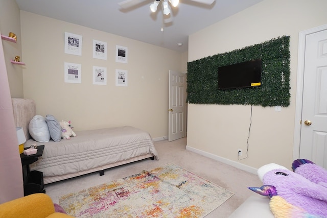 bedroom featuring carpet floors, baseboards, and a ceiling fan