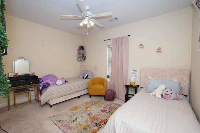 bedroom with carpet, a ceiling fan, and baseboards