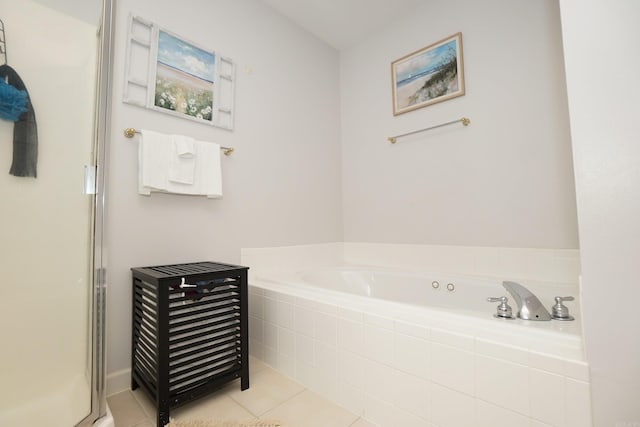 full bath with a bath, tile patterned flooring, and a shower stall