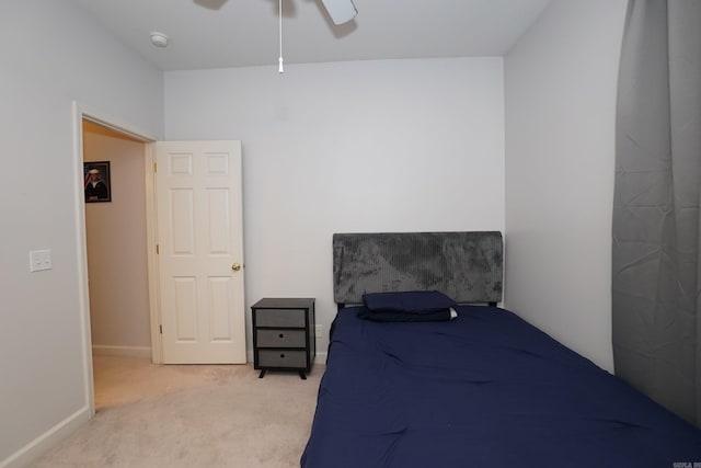 bedroom with carpet flooring, ceiling fan, and baseboards