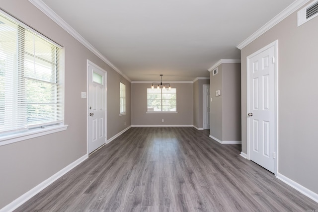 202 Gilbert Dr, Little Rock, AR 72205 - spare room featuring a chandelier, wood finished floors, baseboards, and ornamental molding