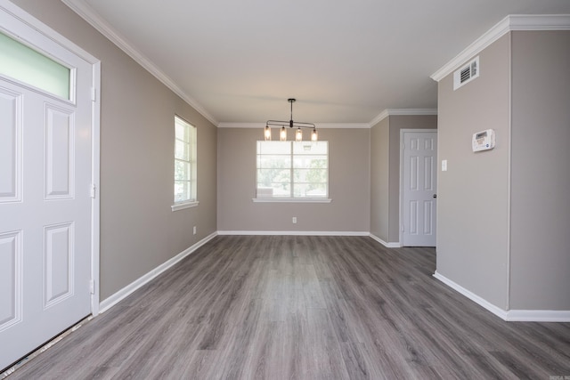 202 Gilbert Dr, Little Rock, AR 72205 - unfurnished dining area featuring wood finished floors, baseboards, a chandelier, and crown molding