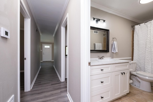 202 Gilbert Dr, Little Rock, AR 72205 - hall with crown molding, a sink, light wood-style floors, and baseboards