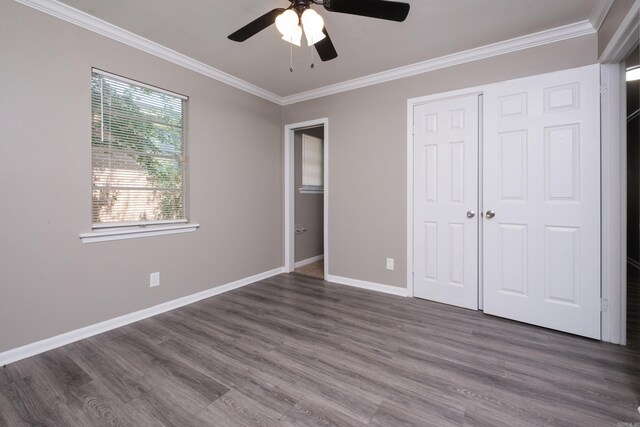 202 Gilbert Dr, Little Rock, AR 72205 - unfurnished bedroom featuring ornamental molding, wood finished floors, baseboards, a closet, and a ceiling fan