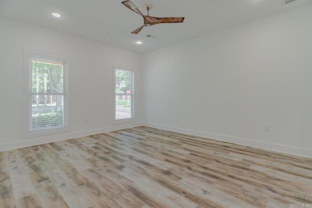 1500 S Church St, Jonesboro, AR 72401 - empty room with healthy amount of natural light, wood finished floors, a ceiling fan, and recessed lighting