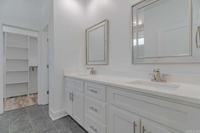 1500 S Church St, Jonesboro, AR 72401 - full bath with marble look tiles, double vanity, and baseboards