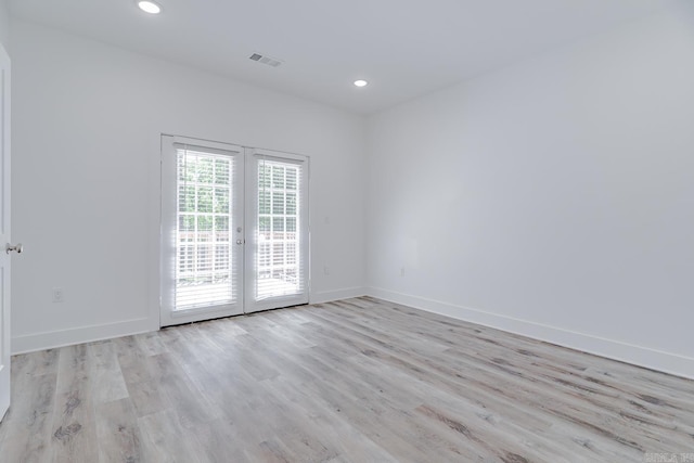 1500 S Church St, Jonesboro, AR 72401 - spare room featuring french doors, wood finished floors, baseboards, and recessed lighting