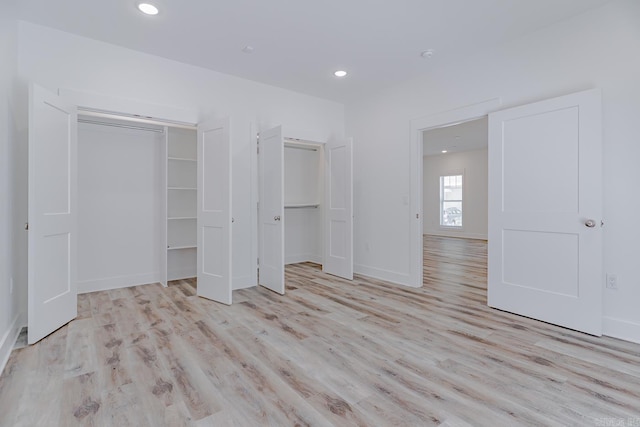 1500 S Church St, Jonesboro, AR 72401 - unfurnished bedroom with light wood-style floors, recessed lighting, and baseboards
