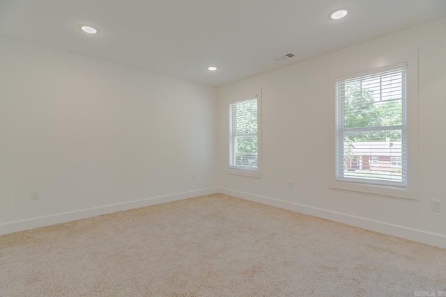 1500 S Church St, Jonesboro, AR 72401 - carpeted empty room with healthy amount of natural light, recessed lighting, and baseboards
