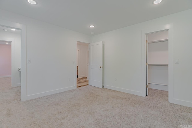 1500 S Church St, Jonesboro, AR 72401 - unfurnished bedroom featuring a spacious closet, carpet floors, recessed lighting, and baseboards