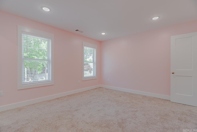 1500 S Church St, Jonesboro, AR 72401 - carpeted empty room with healthy amount of natural light, recessed lighting, and baseboards