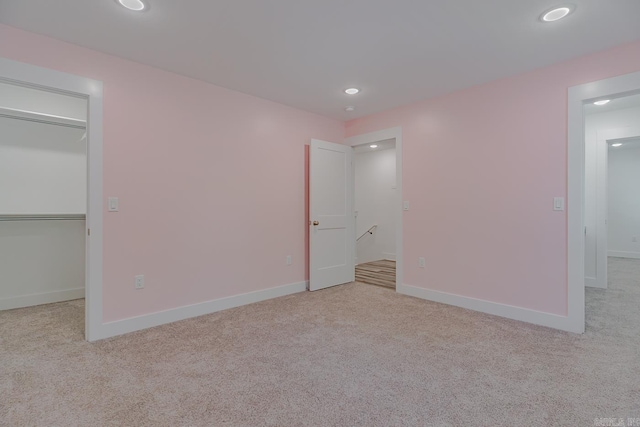 1500 S Church St, Jonesboro, AR 72401 - unfurnished bedroom with a spacious closet, carpet flooring, recessed lighting, baseboards, and a closet