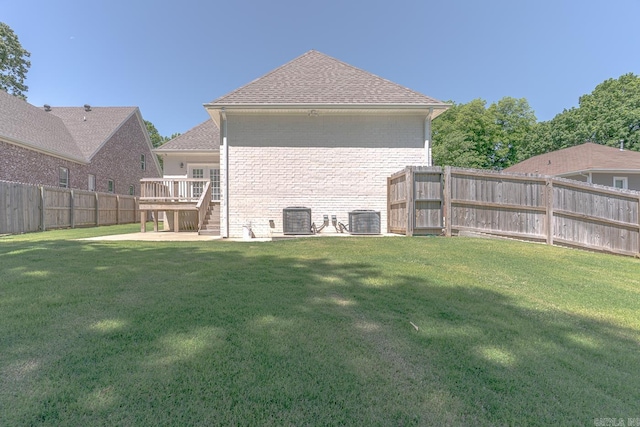 1500 S Church St, Jonesboro, AR 72401 - back of property featuring brick siding, cooling unit, a deck, and a shingled roof
