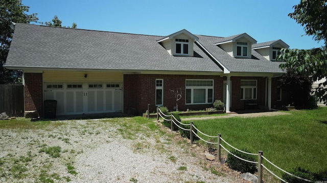 157 E Hawkview Pl, Royal, AR 71968 - cape cod-style house featuring a garage, brick siding, a front lawn, and a shingled roof