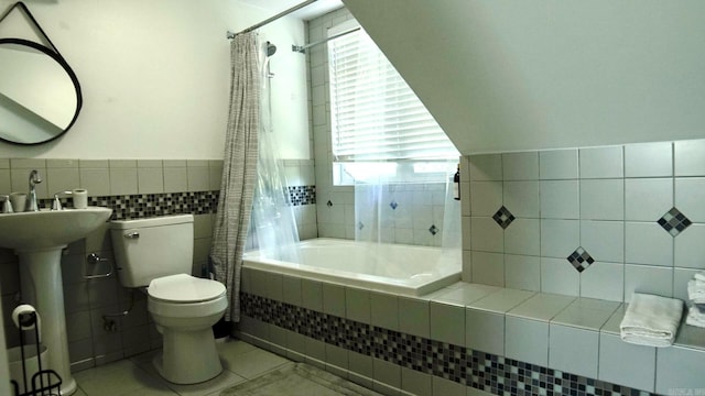 157 E Hawkview Pl, Royal, AR 71968 - bathroom featuring tile walls, toilet, tiled shower / bath combo, tile patterned floors, and wainscoting