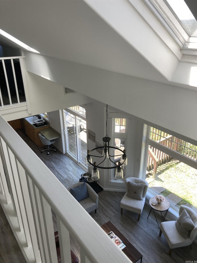 157 E Hawkview Pl, Royal, AR 71968 - stairway featuring wood finished floors, healthy amount of natural light, and a chandelier
