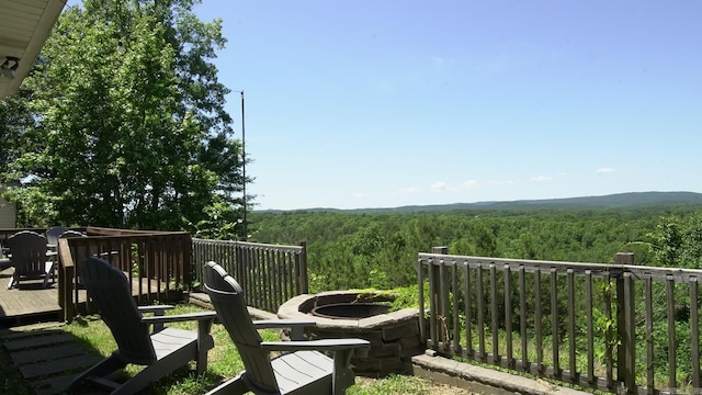 157 E Hawkview Pl, Royal, AR 71968 - deck featuring a view of trees and a fire pit