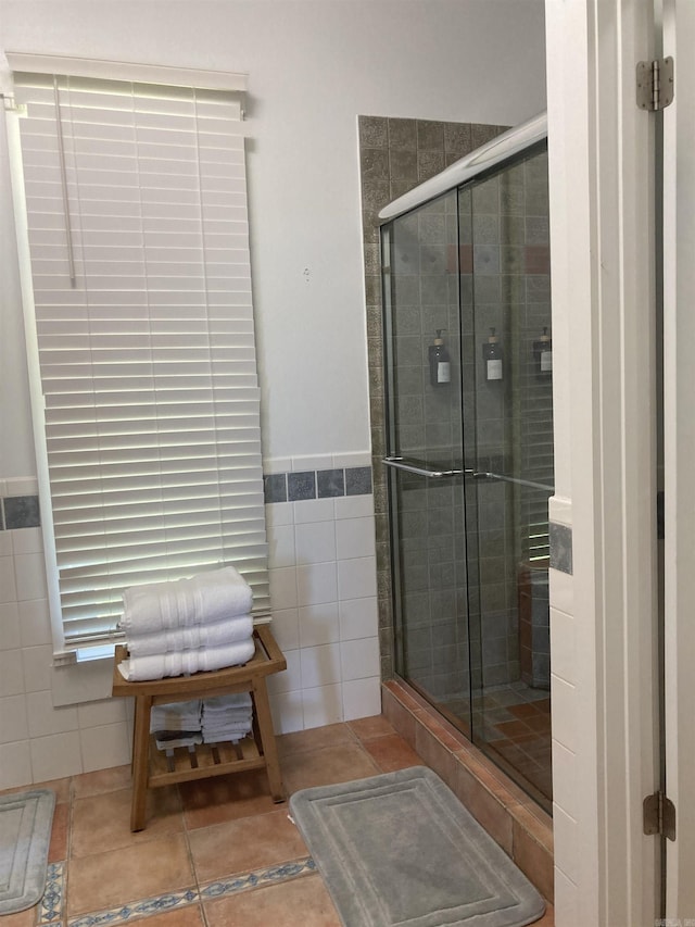 157 E Hawkview Pl, Royal, AR 71968 - bathroom featuring tile walls, a stall shower, tile patterned floors, and a wainscoted wall