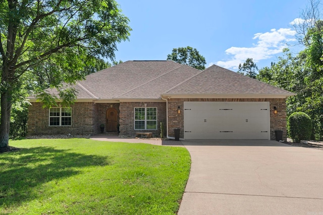 29 Bald Eagle Dr, Paron, AR 72122 - view of front of home featuring a garage, concrete driveway, roof with shingles, brick siding, and a front yard