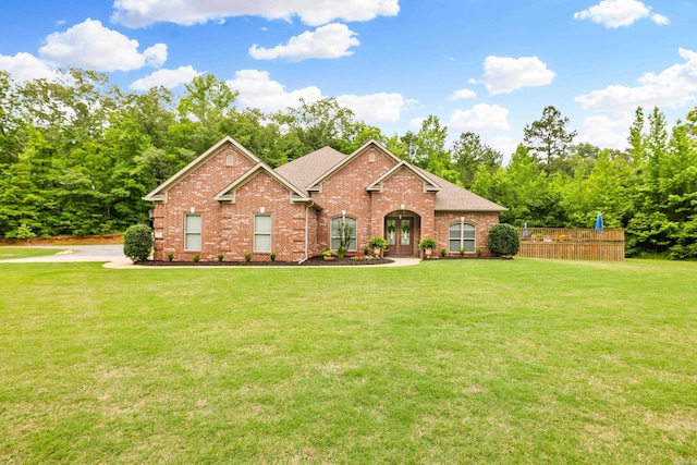 3891 Harrison Rd, Benton, AR 72019 - view of front facade with brick siding, french doors, a front lawn, and a shingled roof