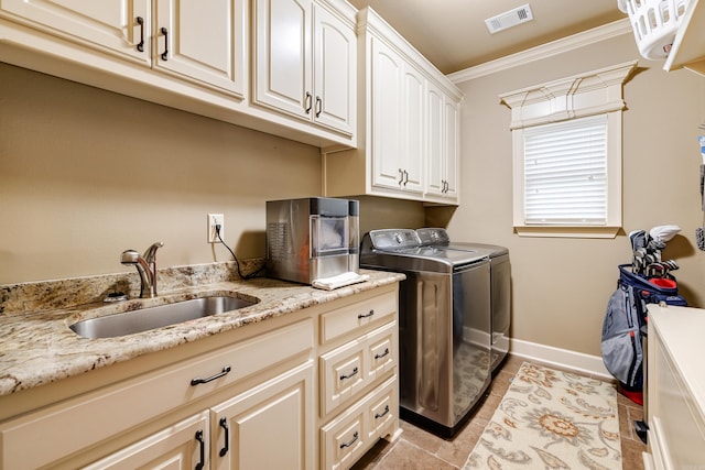 3891 Harrison Rd, Benton, AR 72019 - laundry room featuring cabinet space, independent washer and dryer, crown molding, light tile patterned flooring, and baseboards