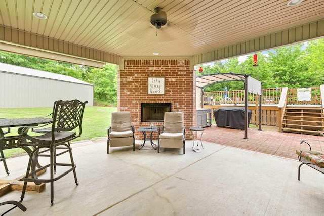 3891 Harrison Rd, Benton, AR 72019 - view of patio / terrace featuring an outdoor brick fireplace and a wooden deck