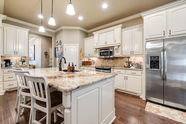 3891 Harrison Rd, Benton, AR 72019 - kitchen featuring stainless steel appliances, light stone counters, ornamental molding, white cabinets, and backsplash