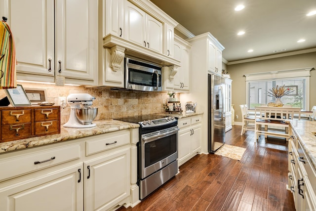 3891 Harrison Rd, Benton, AR 72019 - kitchen with appliances with stainless steel finishes, ornamental molding, recessed lighting, decorative backsplash, and light stone countertops