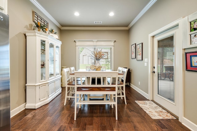 3891 Harrison Rd, Benton, AR 72019 - dining room featuring dark wood-type flooring, crown molding, baseboards, and recessed lighting