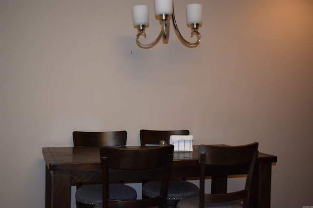 dining space with a chandelier