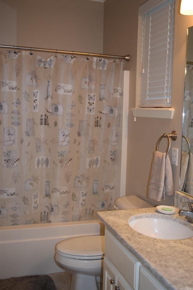 bathroom with vanity, toilet, shower / bath combo, and tile patterned floors
