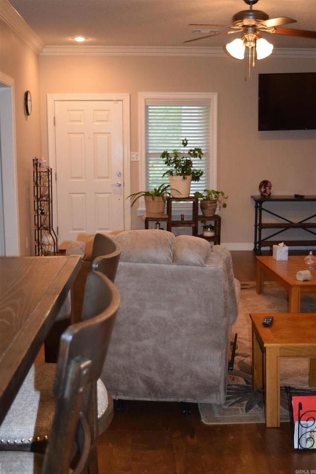 living room featuring ceiling fan, crown molding, and wood finished floors