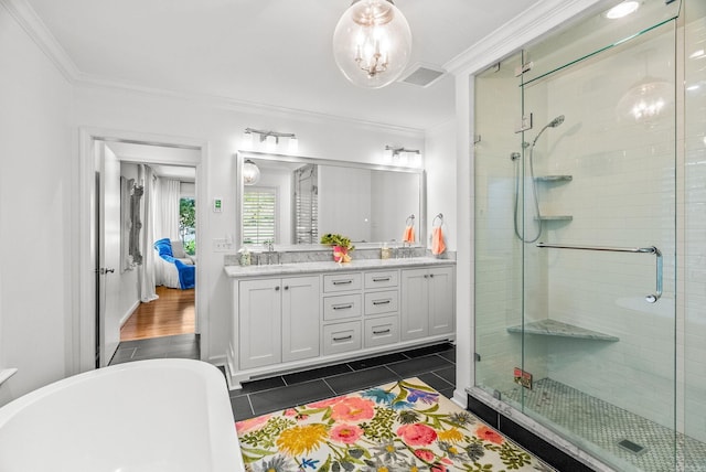5412 S Grandview St, Little Rock, AR 72207 - full bathroom featuring a stall shower, a soaking tub, double vanity, tile patterned floors, and ornamental molding
